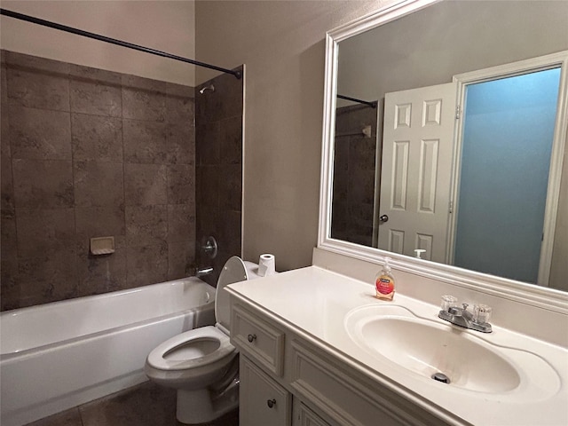 full bathroom with vanity, toilet, tiled shower / bath combo, and tile patterned flooring