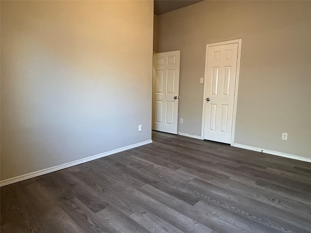 empty room featuring dark wood-type flooring