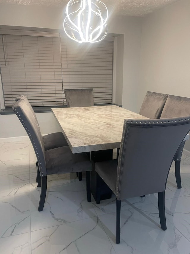 dining room with a textured ceiling