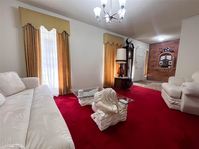 carpeted living room featuring an inviting chandelier and a textured ceiling