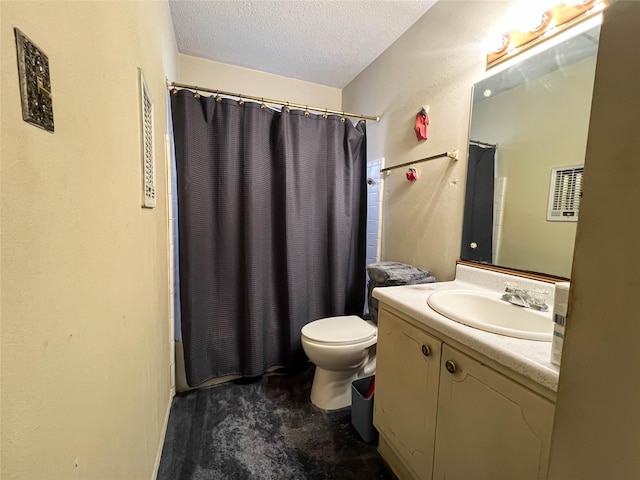 full bathroom featuring vanity, shower / bath combination with curtain, toilet, and a textured ceiling