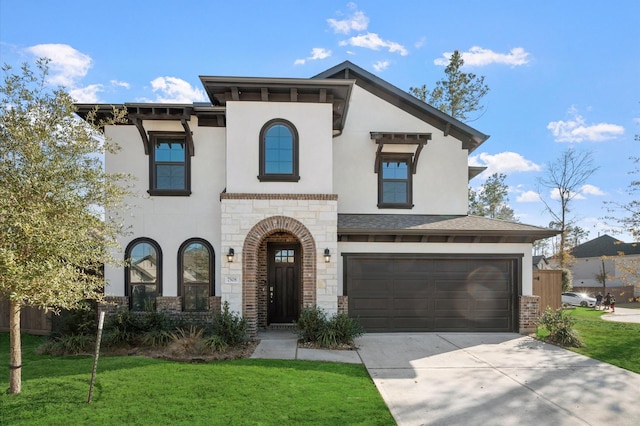 view of front of home featuring a garage and a front lawn