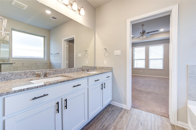 bathroom featuring vanity and ceiling fan