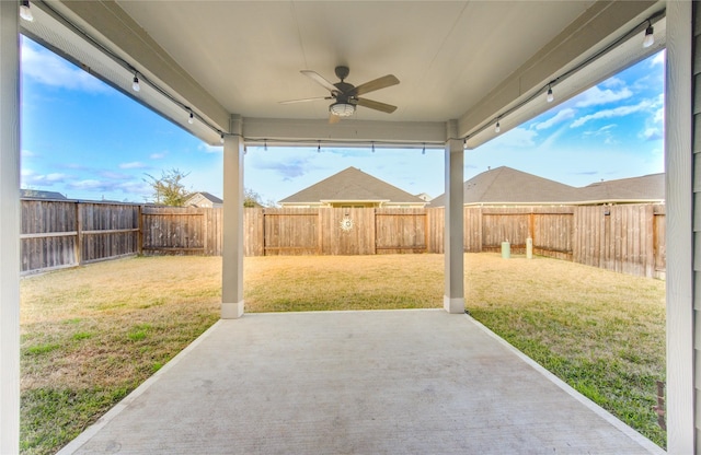 view of patio featuring ceiling fan