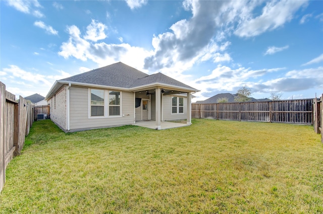 back of house featuring a patio, ceiling fan, and a lawn