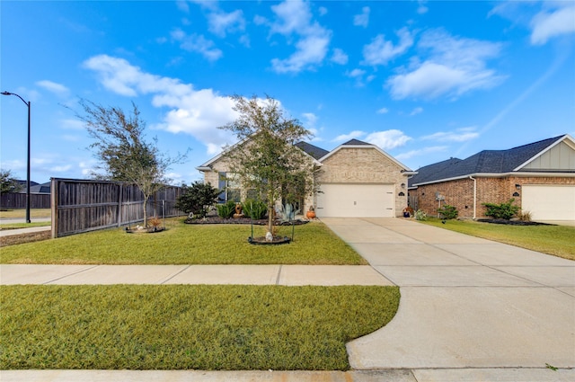 view of front of house with a garage and a front yard