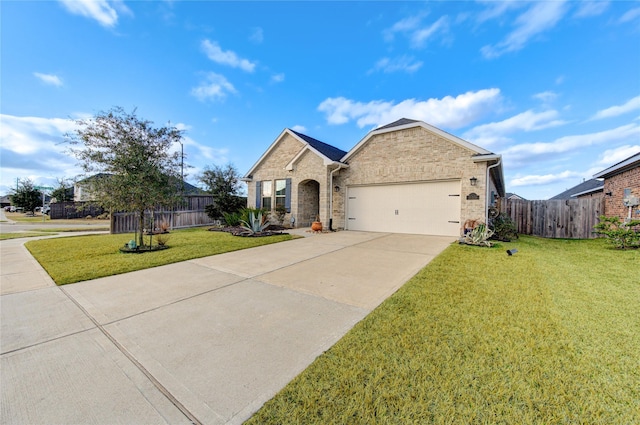 view of front of home featuring a garage and a front lawn