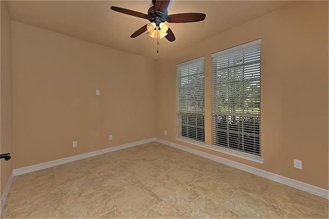 spare room with ceiling fan