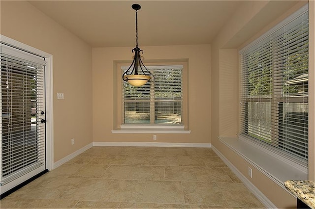 unfurnished dining area featuring a wealth of natural light