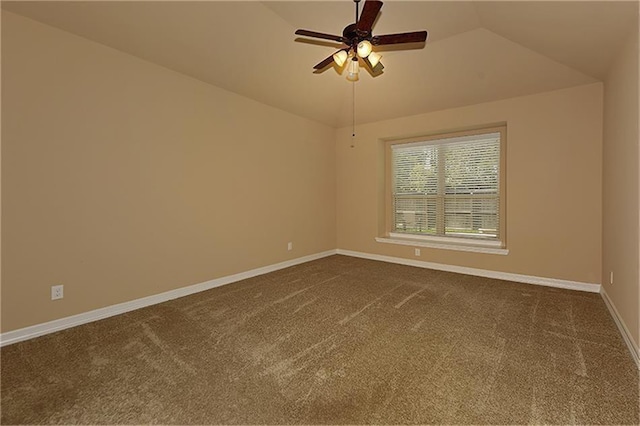 carpeted empty room featuring ceiling fan and lofted ceiling