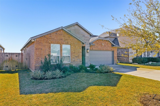 view of front of home with a garage and a front lawn