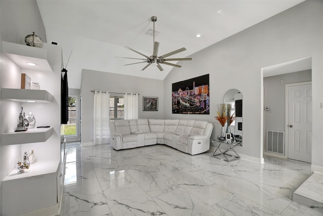 living room with ceiling fan and high vaulted ceiling