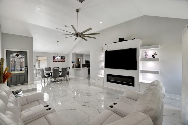 living room featuring ceiling fan and lofted ceiling