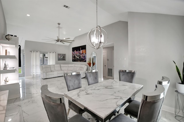 dining area with lofted ceiling and ceiling fan with notable chandelier