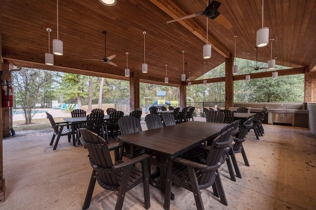 dining room with beamed ceiling, high vaulted ceiling, wooden ceiling, and ceiling fan