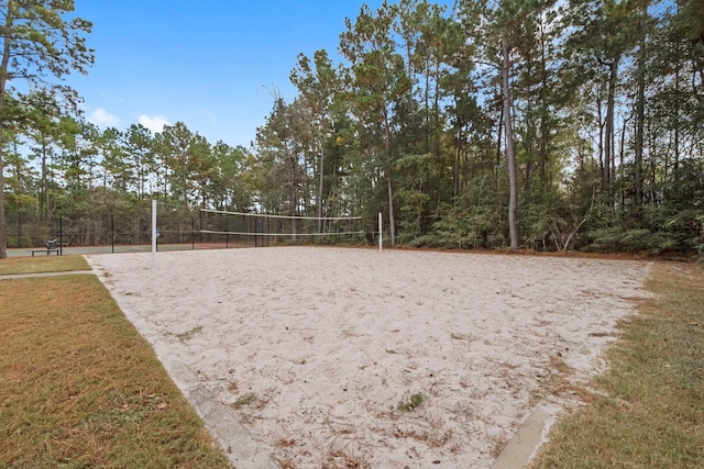 view of home's community featuring a lawn and volleyball court