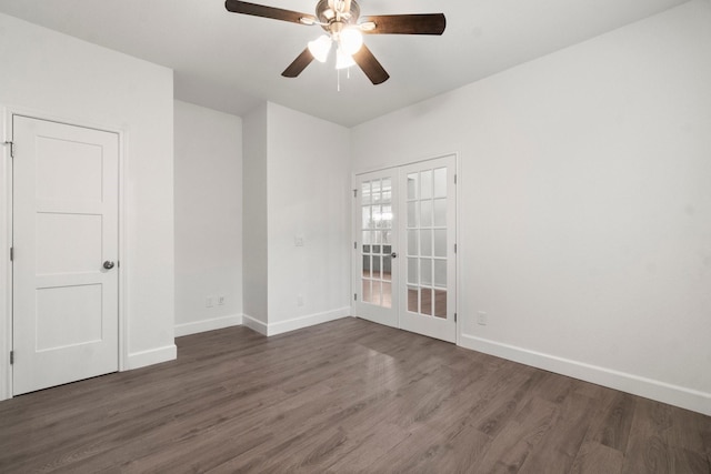 empty room with dark hardwood / wood-style floors, ceiling fan, and french doors