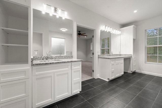 bathroom with ceiling fan, tile patterned floors, and vanity