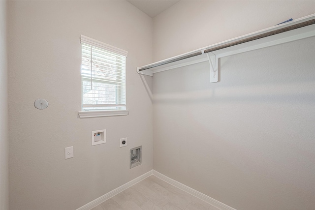 clothes washing area with washer hookup and electric dryer hookup