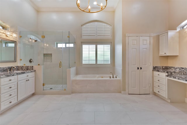 bathroom featuring crown molding, a towering ceiling, vanity, and independent shower and bath