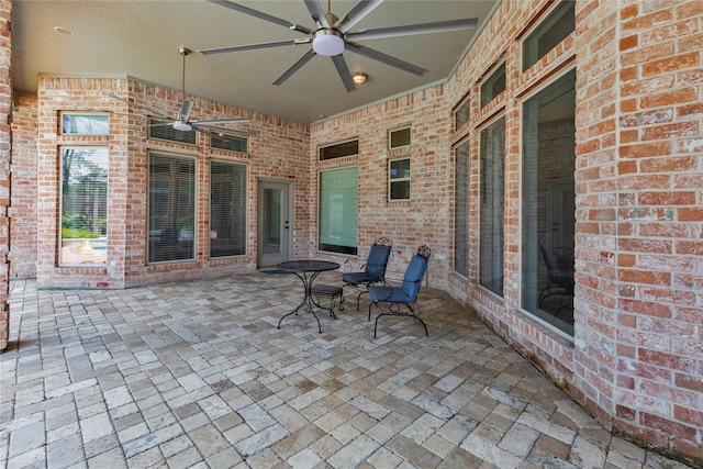 view of patio featuring ceiling fan