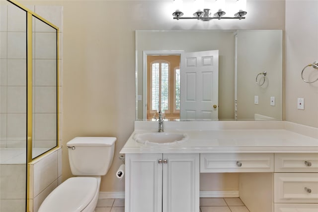 bathroom featuring tile patterned flooring, vanity, and toilet