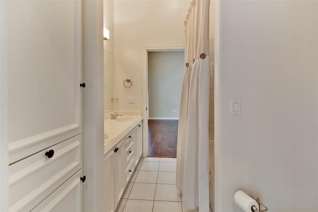 bathroom featuring tile patterned flooring and vanity