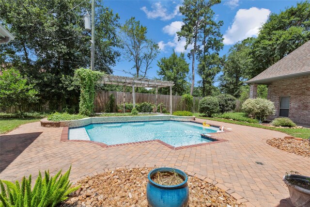 view of pool with a pergola and a patio area