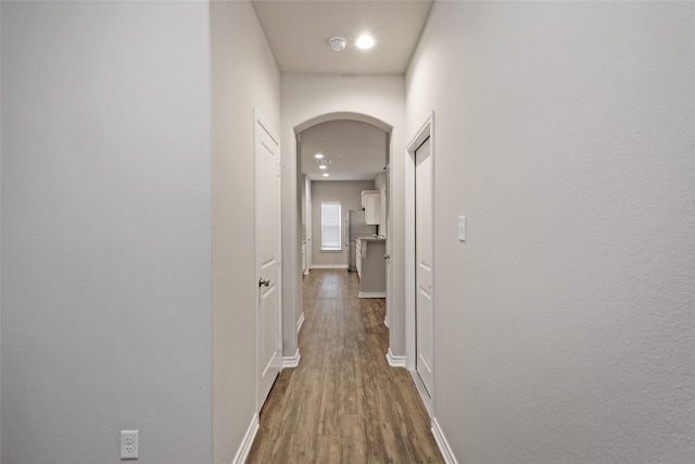 hallway featuring dark hardwood / wood-style floors