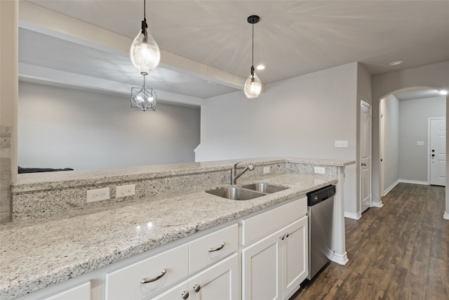 kitchen with sink, light stone counters, white cabinets, decorative light fixtures, and stainless steel dishwasher