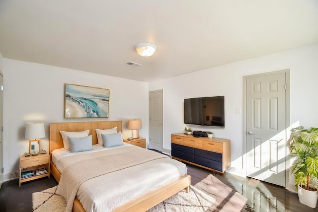 bedroom featuring dark hardwood / wood-style flooring