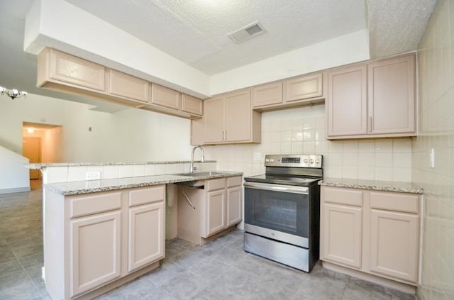 kitchen with tasteful backsplash, light brown cabinetry, sink, and stainless steel range with electric cooktop