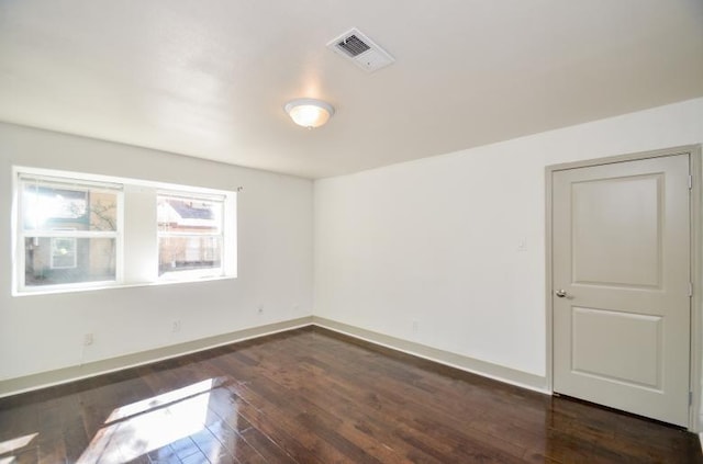 empty room featuring dark hardwood / wood-style floors