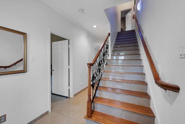 stairway with crown molding