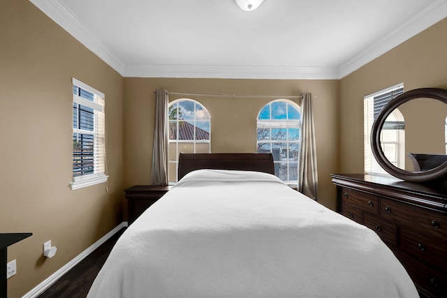 bedroom with crown molding and dark wood-type flooring