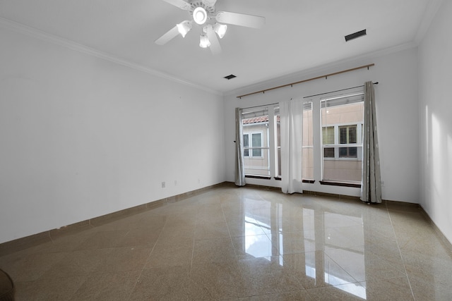 empty room featuring ceiling fan and ornamental molding