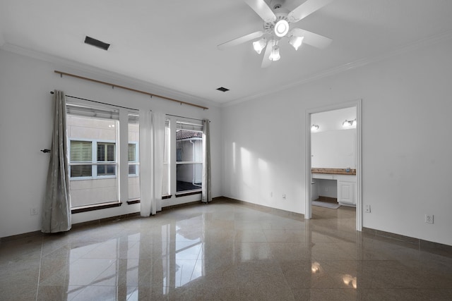 spare room featuring crown molding, ceiling fan, and built in desk