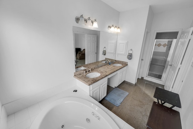 bathroom featuring vanity and shower with separate bathtub