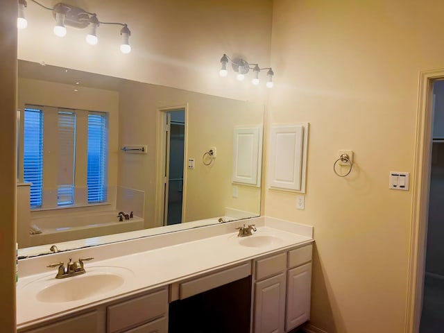 bathroom with vanity and a bathing tub