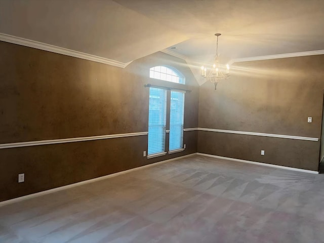 spare room with an inviting chandelier, carpet floors, and ornamental molding