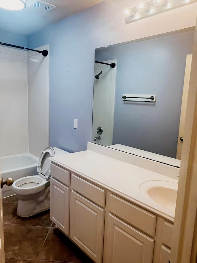 full bathroom featuring vanity, bathing tub / shower combination, and toilet