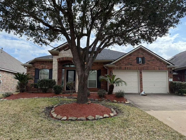 view of front of home with a garage and a front yard