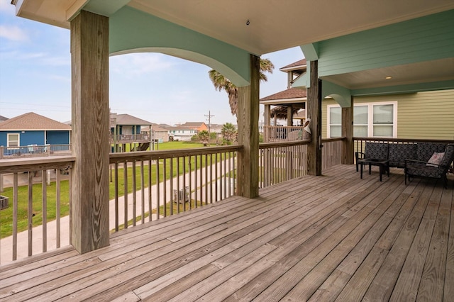 wooden terrace featuring outdoor lounge area