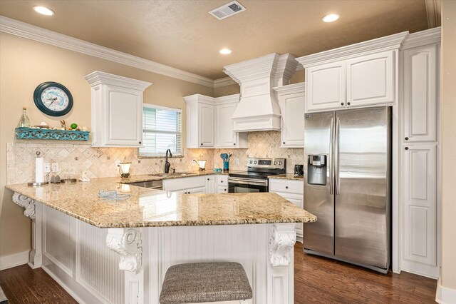 kitchen with white cabinetry, sink, kitchen peninsula, and appliances with stainless steel finishes