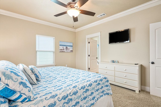 carpeted bedroom with ceiling fan and ornamental molding