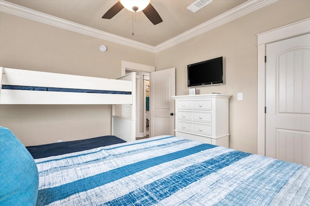 bedroom featuring ornamental molding, visible vents, and a ceiling fan