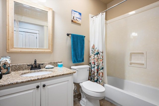 bathroom featuring toilet, vanity, and shower / tub combo with curtain