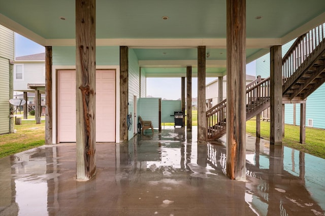 view of patio with a garage and a grill