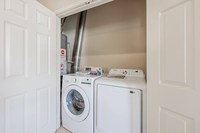 laundry room with washing machine and clothes dryer