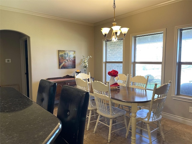 dining space featuring an inviting chandelier and ornamental molding